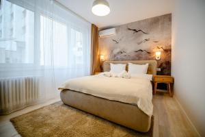 Postel nebo postele na pokoji v ubytování Retreat on Victoriei