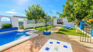a house with a swimming pool and a yard at Casa Carmela in Priego de Córdoba