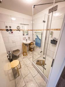 a bathroom with a shower and a sink at Ferienhaus Magasch in Mittenwalde +65 photos