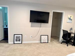 a living room with a flat screen tv on a wall at Home Away in Hanover