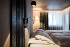 Postel nebo postele na pokoji v ubytování Hotel Cappella