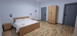 Postel nebo postele na pokoji v ubytování Hotel RADOJA