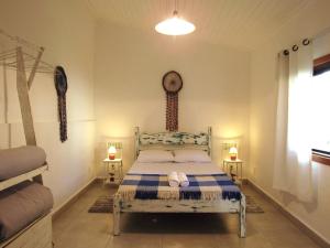 Ένα ή περισσότερα κρεβάτια σε δωμάτιο στο Suíte Alvorada Tiradentes MG