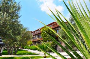A garden outside Assos Park Hotel