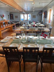 a large dining room with a table and chairs at Krossbu in Boverdalen +28 photos