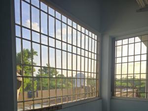 an empty room with a large window with a view at Perumal home stay in Tiruvannāmalai