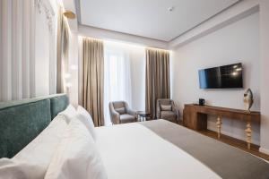 TV a/nebo společenská místnost v ubytování Mae Select Hotel