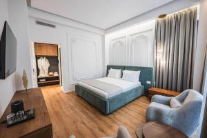 Postel nebo postele na pokoji v ubytování Mae Select Hotel