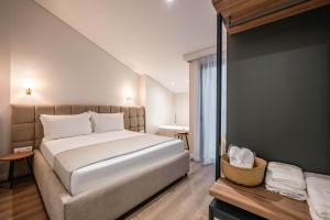 Postel nebo postele na pokoji v ubytování Mae Select Hotel