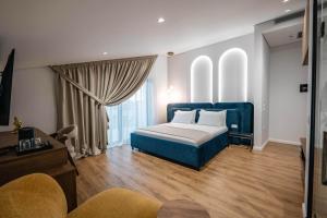 Postel nebo postele na pokoji v ubytování Mae Select Hotel