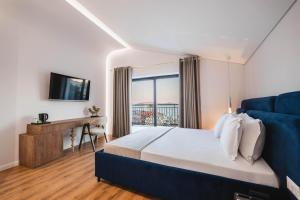 Postel nebo postele na pokoji v ubytování Mae Select Hotel