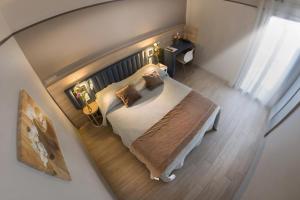 Кровать или кровати в номере Hotel Le Golfe