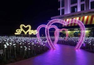a group of hearts lights in front of a building at I-City Homestay at Shah Alam by Landmark in Shah Alam +38 photos
