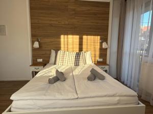 a large white bed with two pillows on it at Rodzinna Ostoja in Zakopane