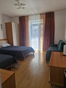 Ένα ή περισσότερα κρεβάτια σε δωμάτιο στο Радуга Вест 27G