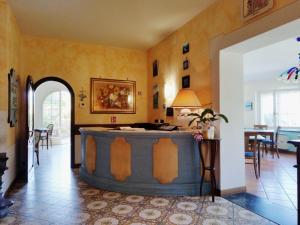 a room with a large barrel in the middle of a room at Locanda Miranda in Tellaro