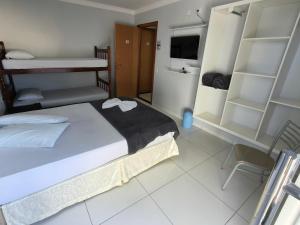 Postel nebo postele na pokoji v ubytování Hotel Vitória - Guaíra