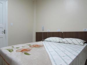 Giường trong phòng chung tại Las Vegas Hotel