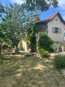 a house with a yard in front of it at Agape in Vailhourles