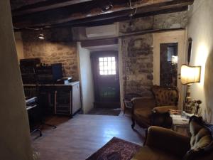 a living room with a couch and a window at B&B Torre di San Caprasio Art Studio in Aulla
