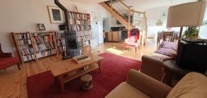 a living room with a couch and a table at Maison à Die in Die +9 photos