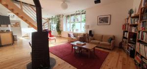 a living room with a couch and a table at Maison à Die in Die