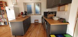 a kitchen with wooden floors and a counter top at Maison à Die in Die