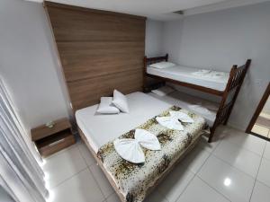 Postel nebo postele na pokoji v ubytování Hotel Vitória - Guaíra