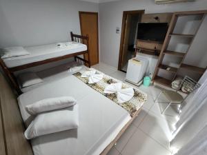 Postel nebo postele na pokoji v ubytování Hotel Vitória - Guaíra