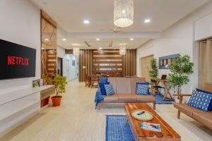 a living room with two couches and a tv at Spacious 3 BHK apartment in Shanti Nagar in Jāmb
