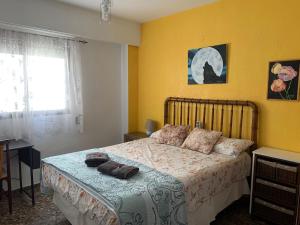 a bedroom with a bed and a window at Plaza Mare Nostrum 5 min playa in Puerto de Sagunto