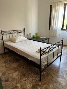 Postel nebo postele na pokoji v ubytování Kalliopi