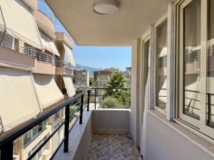 an apartment balcony with a view of the city at Guest House Deon in Vlorë