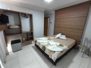 Postel nebo postele na pokoji v ubytování Hotel Vitória - Guaíra