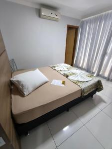 Postel nebo postele na pokoji v ubytování Hotel Vitória - Guaíra