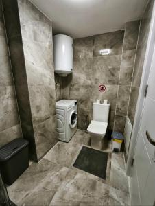 Koupelna v ubytování Aura apartment + 5 fotografií