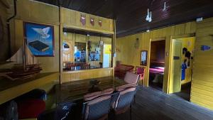 a room with a table and chairs and a bedroom at Cop30 in Belém