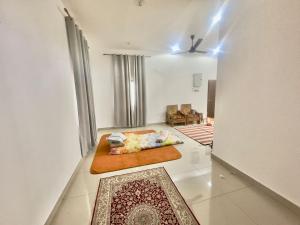 a living room with a bed and a couch at homestay juliana rinching tengah in Gua Sai