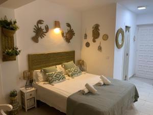 Postel nebo postele na pokoji v ubytování Apartamentos Strand Jávea
