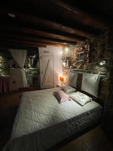 a bedroom with a large bed with a door at Daphne Retreat in Kernitsa