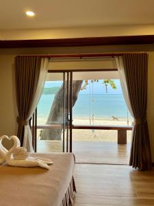 Ein Bett oder Betten in einem Zimmer der Unterkunft Pen's Bungalow Koh Phangan
