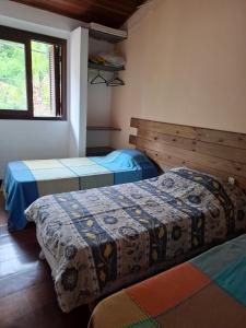 Ein Bett oder Betten in einem Zimmer der Unterkunft Casa na Barra do Una, à beira do Rio Una e frente a Praia