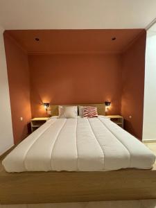 a large bed with a large white comforter at Apartment Heart of Medina Tetuan in Tetouan