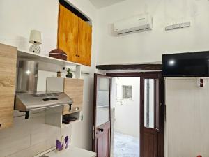 Kuchyň nebo kuchyňský kout v ubytování Cortile Maggiore Home