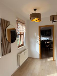 a hallway with a mirror and a dining room at Apartment im Herzen Erfurts in Erfurt