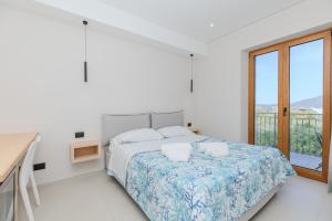 Postel nebo postele na pokoji v ubytování Antares Rooms and Suites