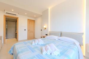 Postel nebo postele na pokoji v ubytování Antares Rooms and Suites