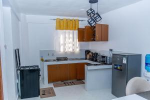 Η κουζίνα ή μικρή κουζίνα στο Executive 1BR Apartment in Elgonview close to Reale Hospital