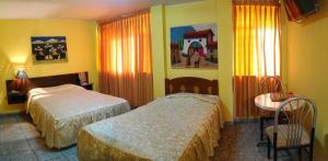Cama ou camas em um quarto em Hostal Iquique
