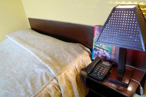 Cama ou camas em um quarto em Hostal Iquique